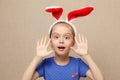 Cute little child girl wearing bunny ears on Easter day.