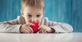 Cute little child holding red heart in hands Royalty Free Stock Photo