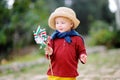 Cute little child holding toy windmill with Italian flag Royalty Free Stock Photo