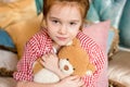 cute little child hugging teddy bear and smiling Royalty Free Stock Photo