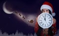 Cute little child and Santa Claus flying in his sleigh against moon sky on background Royalty Free Stock Photo