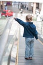 Cute little child in shopping center standing Royalty Free Stock Photo