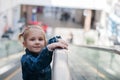 Cute little child in shopping center standing Royalty Free Stock Photo