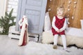 Cute little child sit in wardrobe at christmas Royalty Free Stock Photo