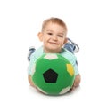 Cute little child with soft soccer ball. Playing indoors Royalty Free Stock Photo