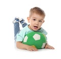Cute little child with soft soccer ball on white. Playing indoors Royalty Free Stock Photo