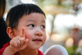 Cute little child thinking, close up, Selective focus, Blurred Background