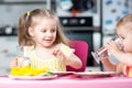 Cute little children drinking water at daycare Royalty Free Stock Photo