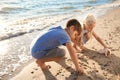 Cute little children gathering sea shells on beach Royalty Free Stock Photo