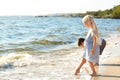 Cute little children gathering sea shells on beach Royalty Free Stock Photo