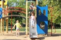 Cute little children having fun on playground outdoors Royalty Free Stock Photo