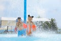 Cute little children having fun in swimming pool at water park Royalty Free Stock Photo