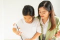 cute little children intend to learn painting color with teacher in education classroom with copy space. asian beautiful children Royalty Free Stock Photo