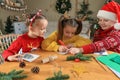 Cute little children making Christmas greeting cards at home Royalty Free Stock Photo