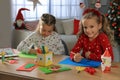 Cute little children making Christmas greeting cards at home Royalty Free Stock Photo