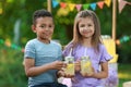 Cute little children with natural lemonade. Summer refreshing drink