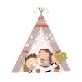Cute little children play in a tent teepee
