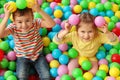 Cute little children playing in ball pit Royalty Free Stock Photo