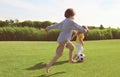 Cute little children playing football in park on sunny day Royalty Free Stock Photo