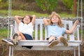 Cute little children playing outdoors. Portrait of two happy young kids at the spring park. Cute lovely boy and girl Royalty Free Stock Photo