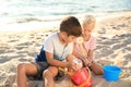 Cute little children playing with sand on sea beach Royalty Free Stock Photo