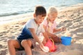 Cute little children playing with sand on sea beach Royalty Free Stock Photo