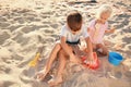 Cute little children playing with sand on sea beach Royalty Free Stock Photo