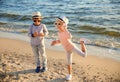 Cute little children playing with sea shells on beach Royalty Free Stock Photo