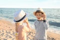 Cute little children playing with sea shells on beach Royalty Free Stock Photo