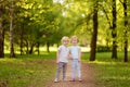 Cute little children playing together and holding hands in sunny Royalty Free Stock Photo