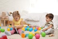 Cute little children playing with toys on floor Royalty Free Stock Photo