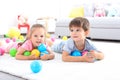 Cute little children playing with toys on floor at home Royalty Free Stock Photo