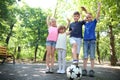 Cute little children with soccer ball in park Royalty Free Stock Photo