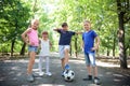 Cute little children with soccer ball in park Royalty Free Stock Photo