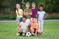 Cute little children with soccer ball in park Royalty Free Stock Photo