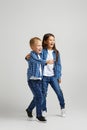 Cute little children in stylish denim clothes Royalty Free Stock Photo