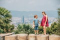 Cute little children tourists admiring Barcelona city