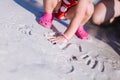 Cute little curly baby play on beach