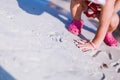 Cute little curly baby play on beach