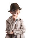 Cute little detective with magnifying glass on white background Royalty Free Stock Photo