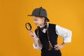 Cute little detective with magnifying glass