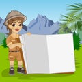 Cute little explorer girl in safari outfit showing giant book open in the jungle