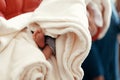 cute little feet of a boy in soft comfortable blanket at christening ceremony in church in godfather hands. baptise baby Royalty Free Stock Photo