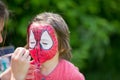 Cute little five years old boy, having his face painted as spid Royalty Free Stock Photo