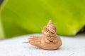 Cute little Ganesh clay sculpture with space on blurred green banana leaf background Royalty Free Stock Photo