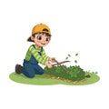 Cute little gardener boy with plants and shovel
