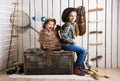 Cute little girl with another little girl in backpack Royalty Free Stock Photo