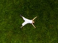 Cute little girl lying on green grass in park Royalty Free Stock Photo