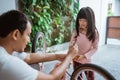 cute little girl while attaching a pedal with her father