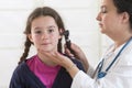 Cute little girl attending a medical check-up Royalty Free Stock Photo